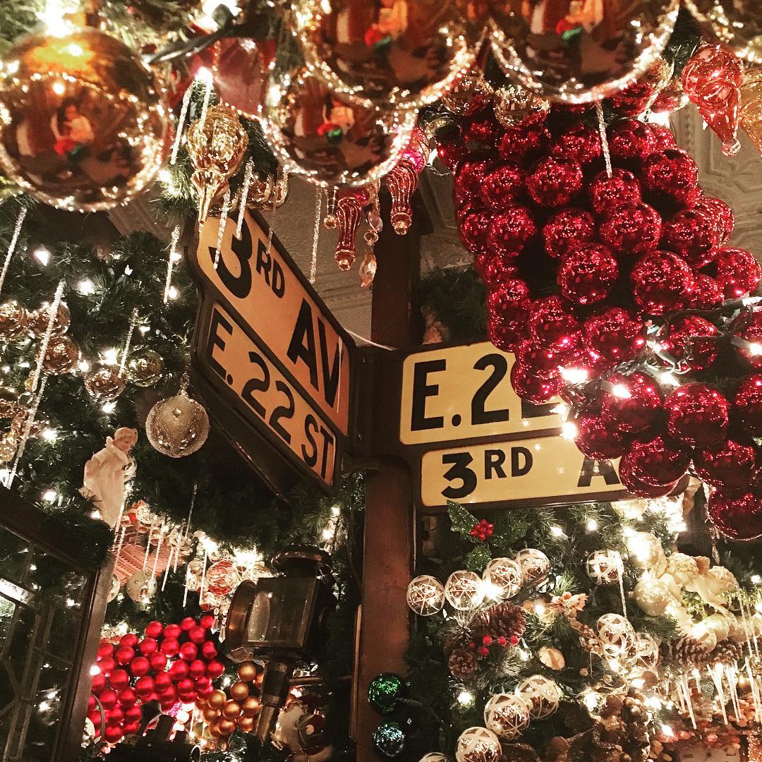 Thousands of Christmas ornaments adorn bar