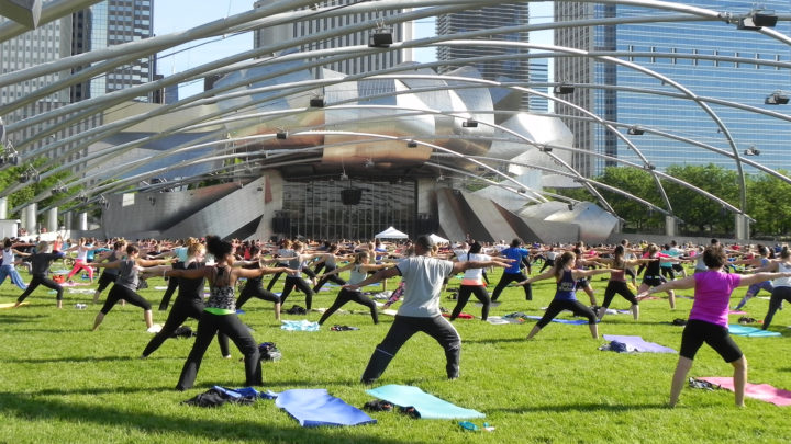 An image of people practicing zumba in Millennium Park in Chicago