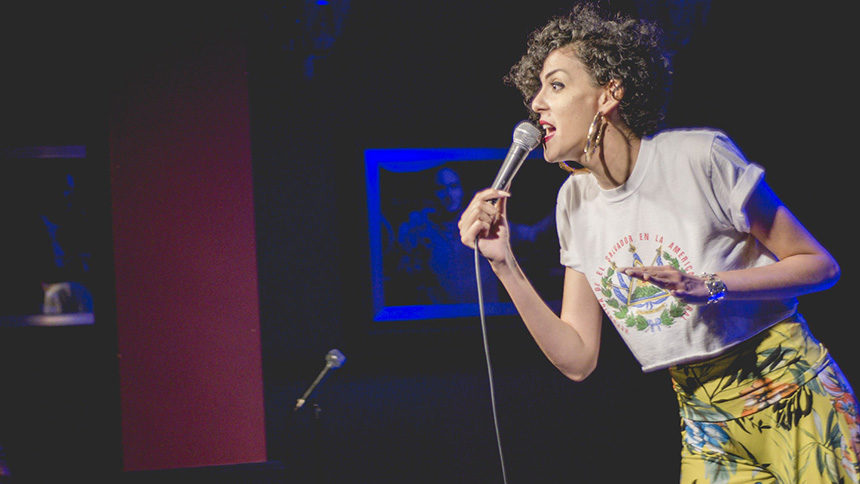 Marcella performing stand-up comedy in Hollywood, California