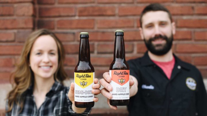 Owners of Right Bee pose with cider bottles